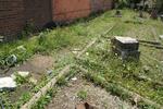 Rubbish between the graves & sidewalk